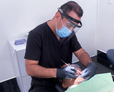 dentist in cabo san lucas working on a patient.